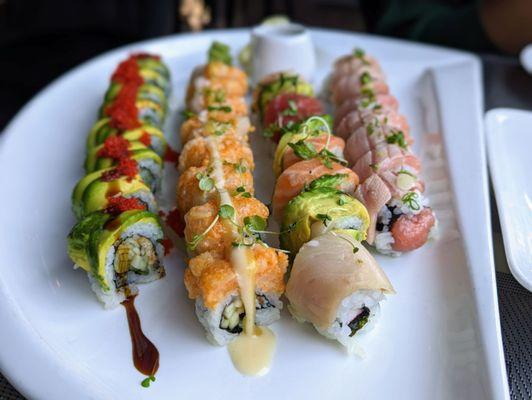 December 28, 2022; Dragon roll ($16), crispy chilean sea bass roll ($21), rainbow roll Fushimi style ($16), Toro toro roll ($25).