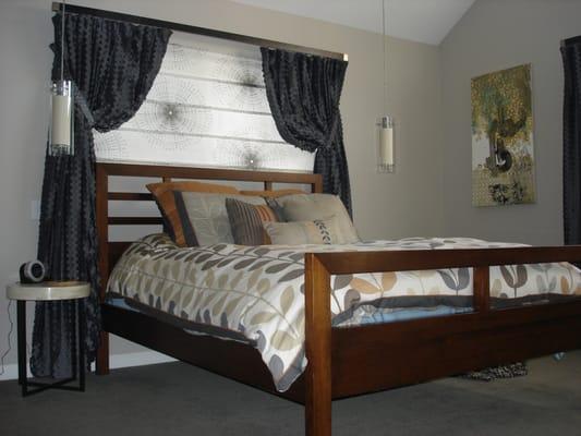 Roman Shades and Draperies in a master bedroom