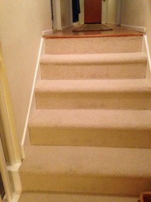 Ryan put down this beautiful Berber carpet on the stairs using a "tuck and roll" technique that made them elegant.