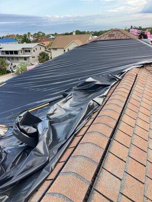 Emergency Tarping that MDR provided free of charge before the storm to prevent old roof from leaking. Going now to make way for new roof.