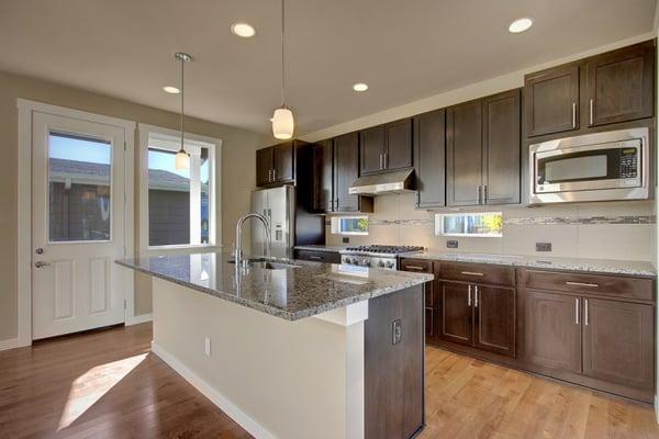 Kitchen with large island and stainless steel appliances (image borrowed from BDR, LLC's website)