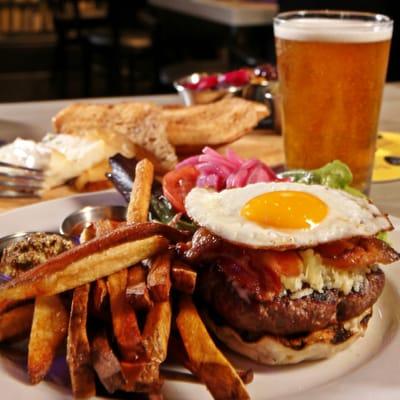 6 Mile Burger - Ground Beef, sunny side up egg, bacon, Ludlow cheese, English muffin bun, truffle fries, charred tomato-ancho ketchup