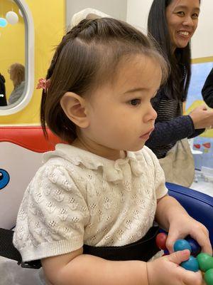 Mei's first haircut. Mom's smile tell us all.