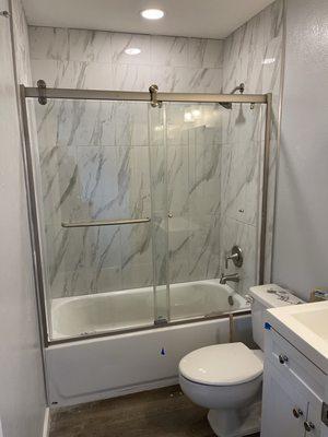 Tile, shower door installation, paint, toilet, vanity installation. Flooring