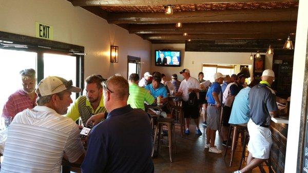 Golf and Grow members enjoying happy hour after the tournament. We always buy the first beer.