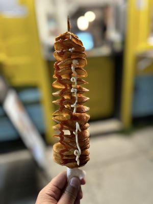 Potato tornado with ketchup and mayonnaise