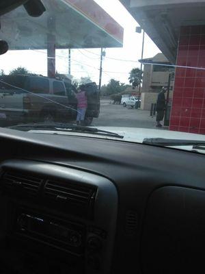 Car wash with window squeegee