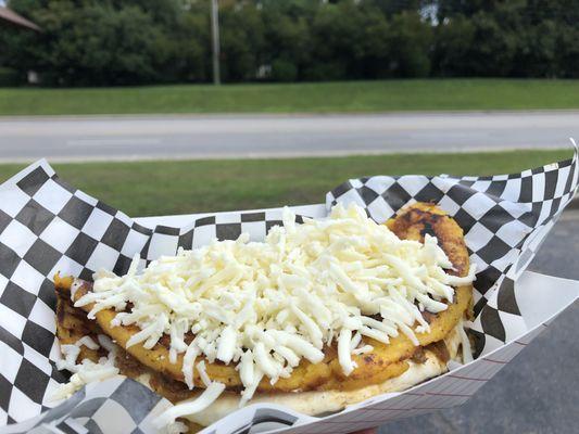 Beef Cachapa topped with Cheese.