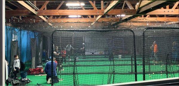 Customers are hitting in the batting cages in the facility.