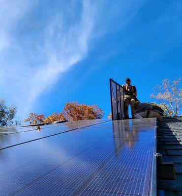 SunDay Solar DC Team laying down panels on a beautiful residential installation in Central Virginia!