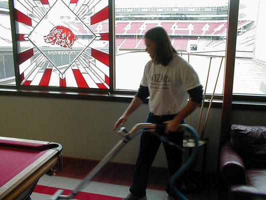 Cleaning the rugs at Razorback Stadium (University of Arkansas) in preparation of the football season