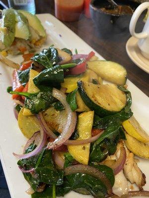 Grilled black drum fish topped with fresh vegetables.