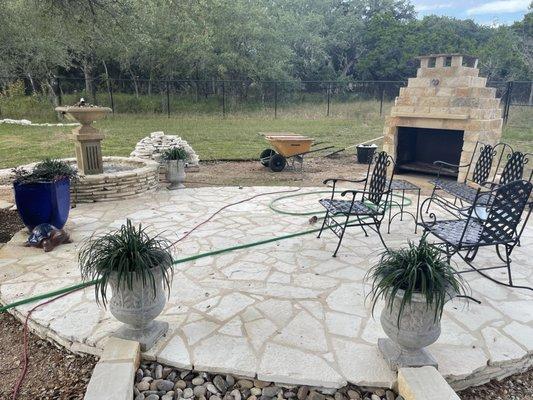 Patio with built in fountain and fireplace place