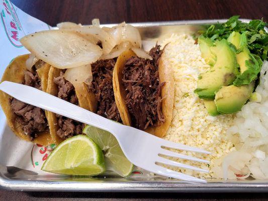 Tacos with toppings ordered on the side.