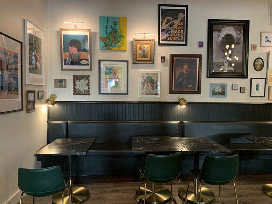 Seating between the bar space and bookstore along the back wall.