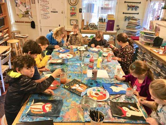 Young artists at work in the main studio.