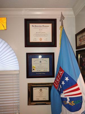 The newest diploma is at the top. One Price Framing did a great job!