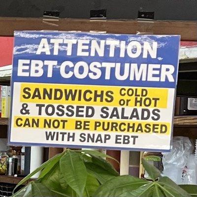 Makeshift sign denying SNAP EBT users their right to purchase cold food. This goes against HRA's guidelines.