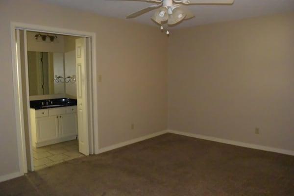 Private, large bedroom has separate vanity and water closet areas