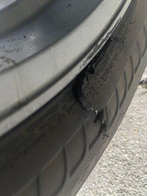 Badly damaged tire- he looked to see if he could fix it but there's no fixing this...