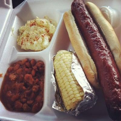 1/4lb all beef hotdog, bakes beans, potato salad and corn