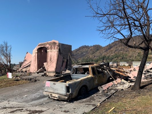 a home in my neighborhood destroyed by wildfires - all smoke, soot, toxins and chemicals from this home entered my home