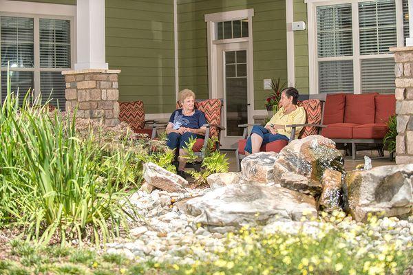 Dominion Senior Living of Hixson | residents talking on patio