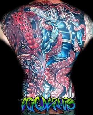 A custom color backpiece cover-up tattoo covering up an older backpiece, done by Colin Nolt at Epicdermis Custom Tattoos For Cool People.