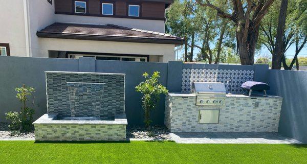 A water Feature and Outdoor BBQ are the perfect Upgrade to any Yard!