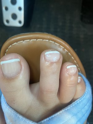 Crooked lines on every toe, none of them even go the full length of my nail they cut off early. Big toe looks awful.