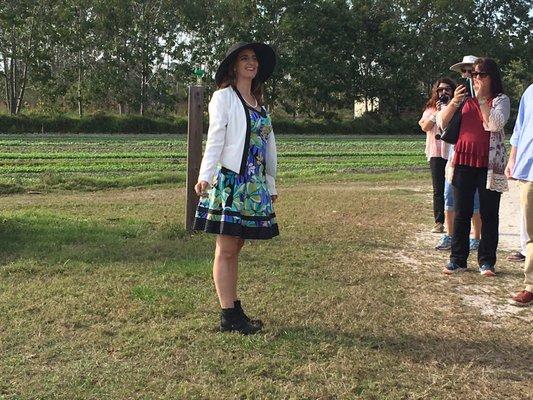 Eva Worden, showing a group around the farm at an Outstanding in the Field dinner