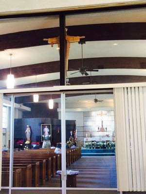 Standing outside the church in the church hall, which is attached to the church.