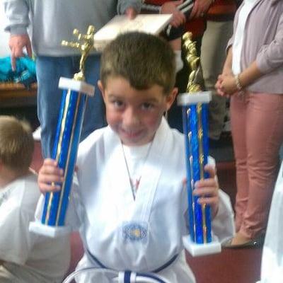 student  with his trophies