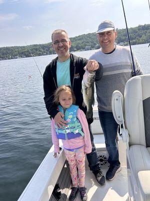 First catch on her own even though she didn't want to hold the bass for the photo.