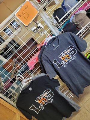 Llano High School spirit wear available on the shelf.