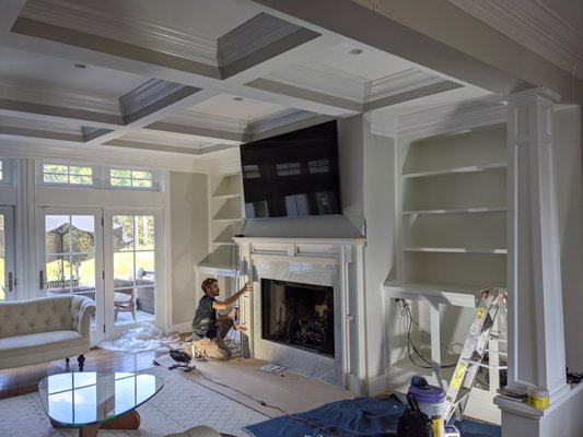 Fireplace built in and Bookshelf and a beautiful coffered ceiling