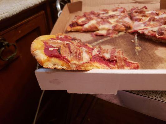 "Hand-tossed" crust in reality is premade, frozen, and shipped.  Dense, heavy, chewy, and tasteless.