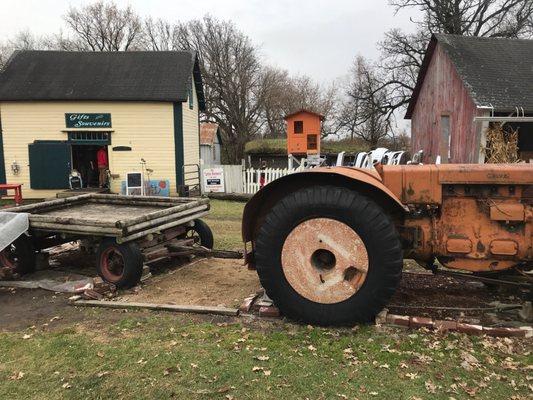 Tractor to climb on, small Playground in back,gift shop in cream bldg