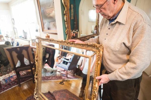 Handling one of our fine custom mirror designs for a client