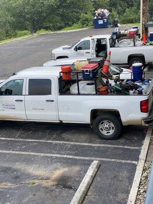 Trucks with drums filled with glyphosate right by the rooms. Overflowing trash.