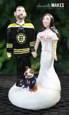 A couple with there dog - clearly Boston fans!