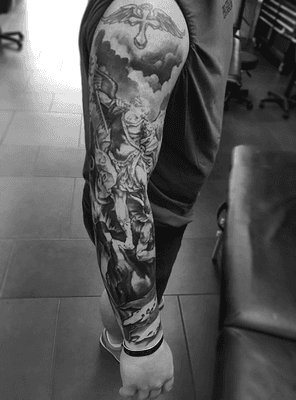 Black and Grey Realism St. Michael Sleeve Tattoo