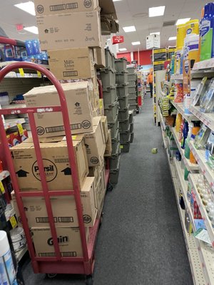 Typical for this store- boxes and crates all Over the aisles.