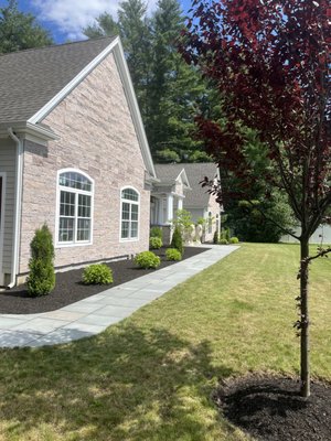 Bluestone walkway and close up of marble on the house