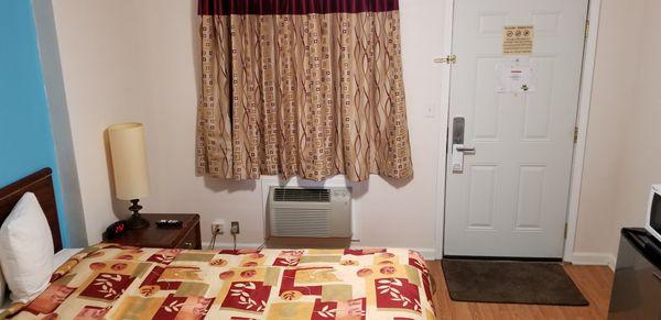 A look toward the entry door leading directly outside. Note my surge protector on the wall, bottom left. Built in heater/fan/air conditioner