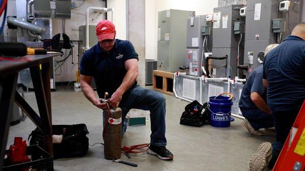 HVAC student preparing to braze