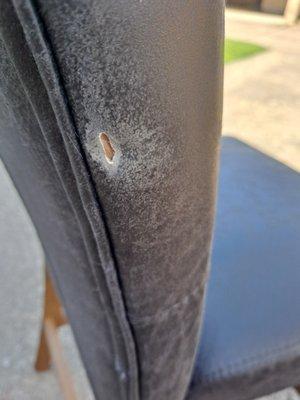 hole in my cafe chair Caused by their stacking in the truck