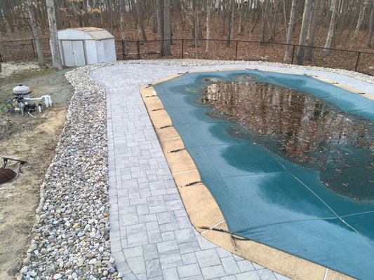 Pavers and river stone surrounding existing pool deck. Ocean, NJ