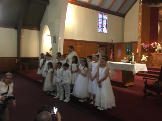 Father Souza with recipients of First Holy Communion!