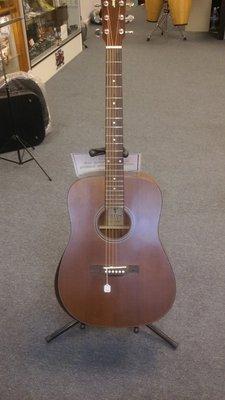 This wonderful guitar, made of Solid Mahogany top, back, and sides, has an arm rest cut-out.